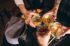 Male and female hands close up with cocktails